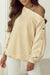 Beige sweatshirt with buttoned sleeves and dropped shoulders