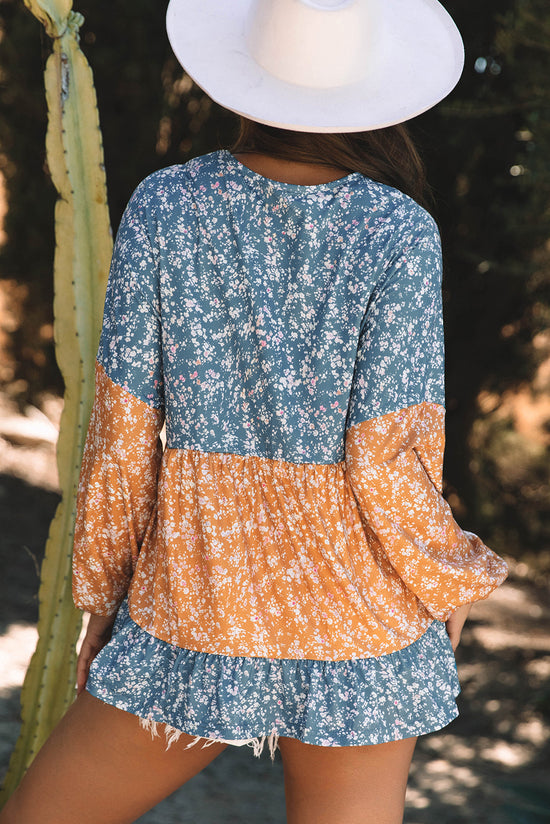 Blusa naranja con flores y bloques de color *