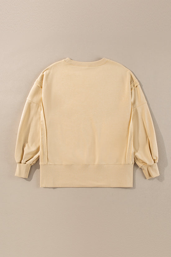 Sudadera beige beige francesa ligera, hombros caídos, cuello redondo y hendiduras