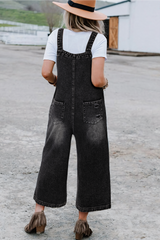 Salopette en jean noir effet vieilli avec poche à bavette et jambe large