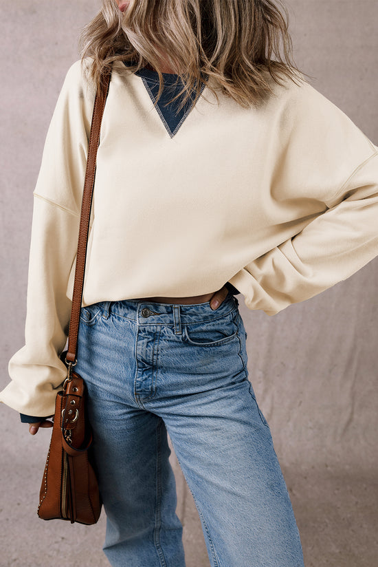 White oversized sweatshirt with dropped shoulders and color block patch