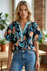 Chemisier noir à fleurs, manches courtes bouffantes