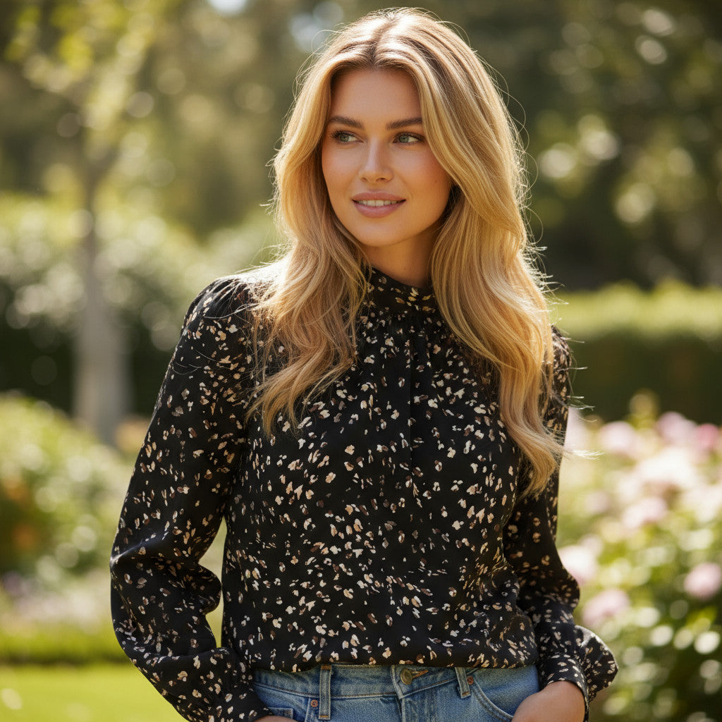 Ploted blouse with rising collar and lantern sleeves *