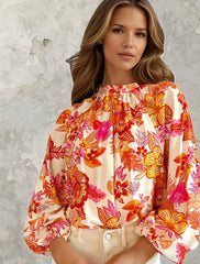 Blusa de impresión floral y botón de perla con orificio de bloqueo *