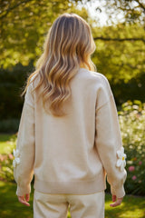 Elegant button front cardigan with parchment floral decoration