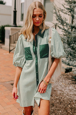 Green dress with plated and buttoned pockets *