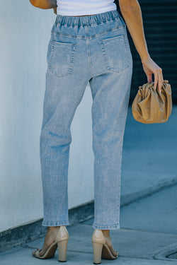 Denim jogging pants with round pockets in blue sky distress