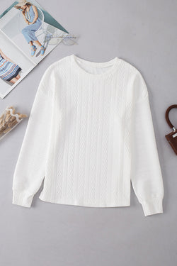 White textured knit top with crew neck and dropped shoulders