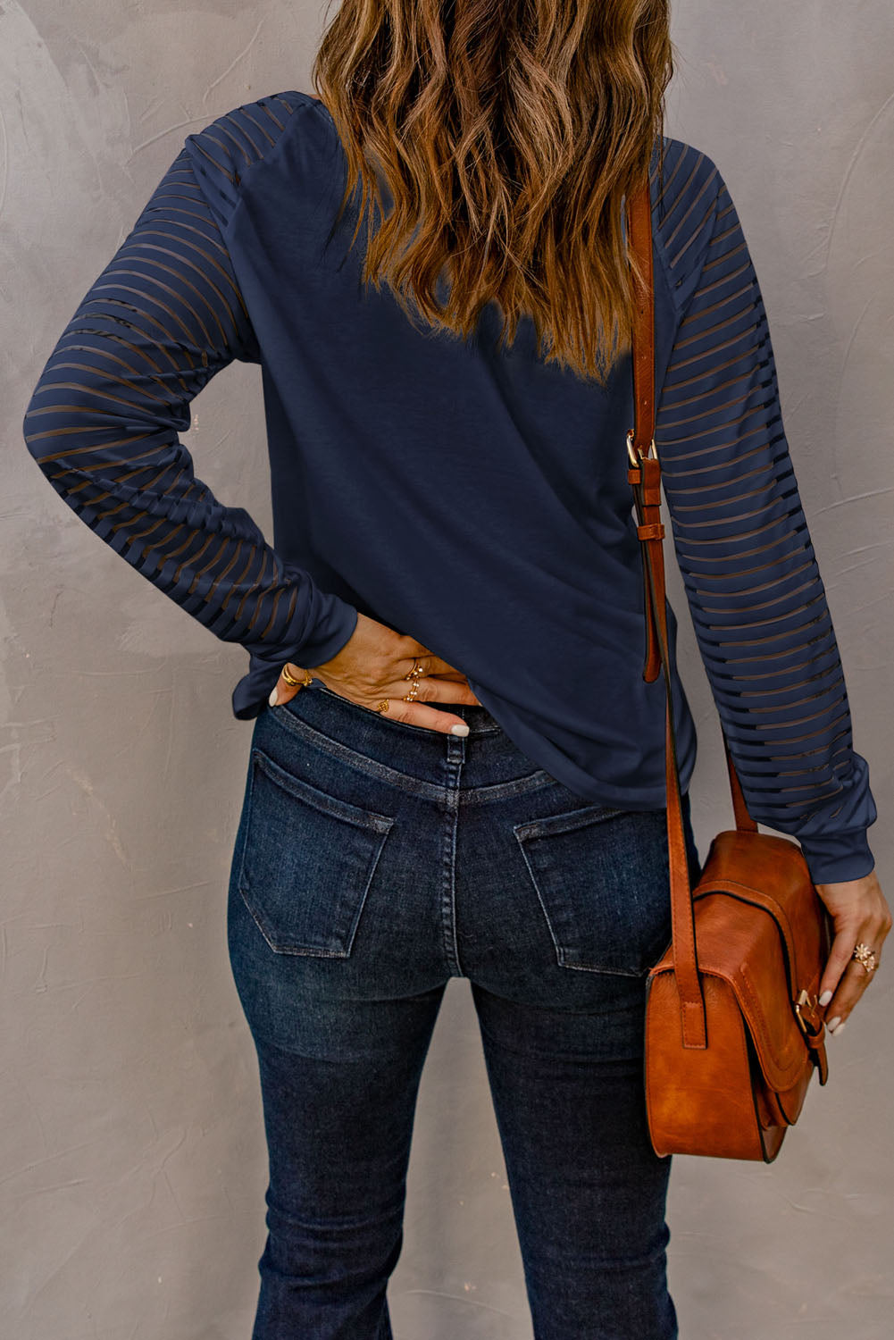 Blue V-neck top with sheer stripes