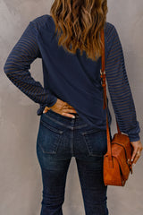 Blue V-neck top with sheer stripes