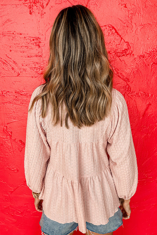 Light pink textured fluid blouse on several levels