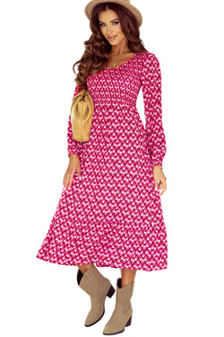 Long -waved gathered dress with geometric print and v -collar