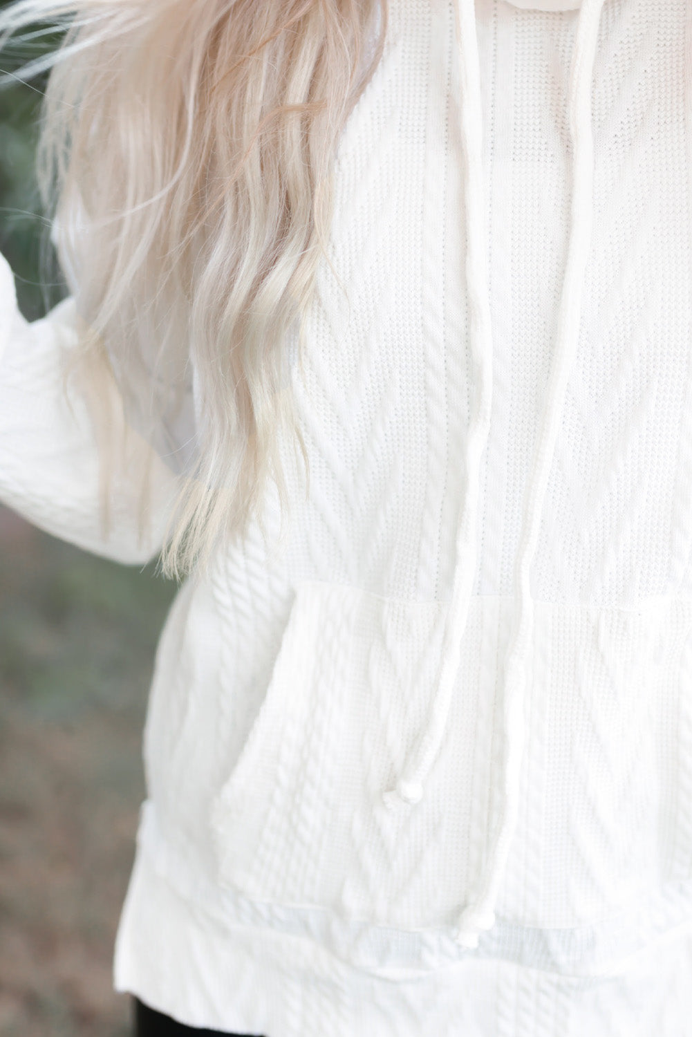 White textured sweatshirt at housing collar