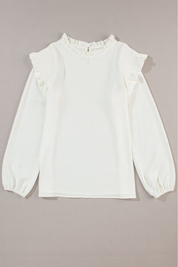 White blouse with puffy sleeves and ruffle border and ruffle collar