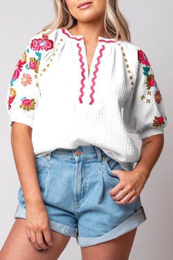 White textured blouse with puffy sleeves and Ricrac floral embroidery