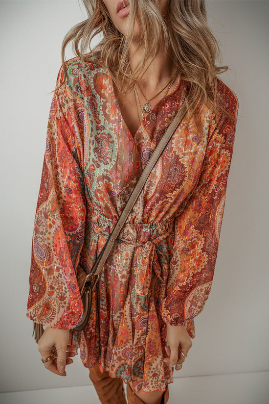 Orange bohemian paisley print mini dress with long sleeves and pleated belt