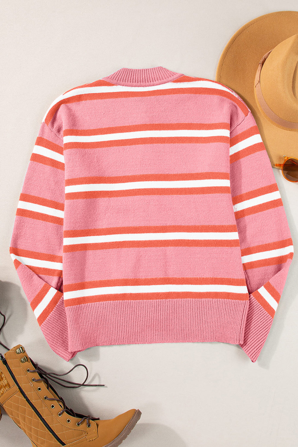 Pink striped cardigan sweater with dropped shoulders and buttons