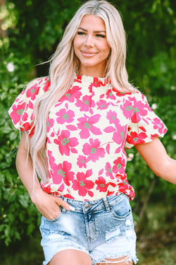 Blusa beige con flores y mangas hinchadas *