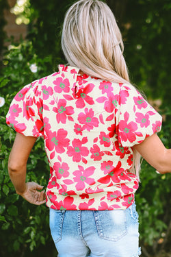 Blusa beige con flores y mangas hinchadas *