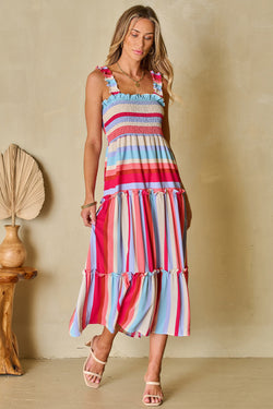 Long smocked dress with ruffles and red striped straps