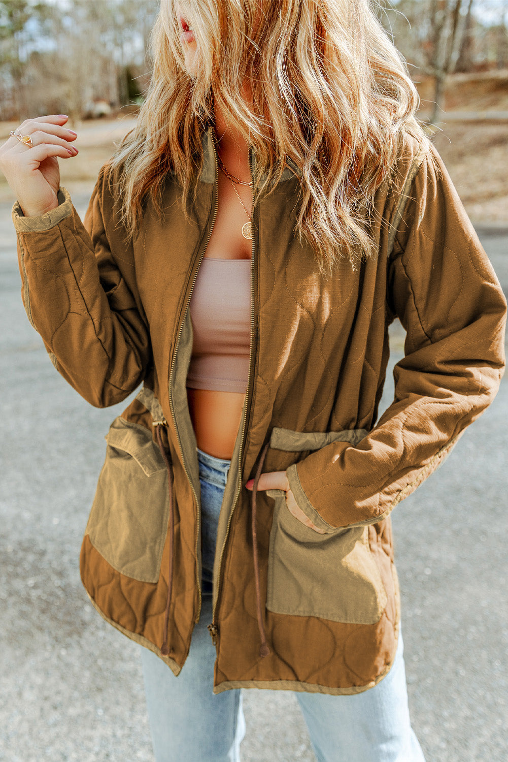 Quilted tightening cord jacket and brown stitching