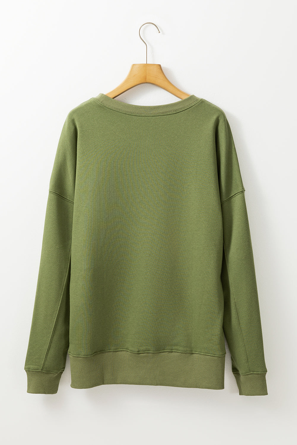 Ample sweatshirt with pockets and crossed seams *