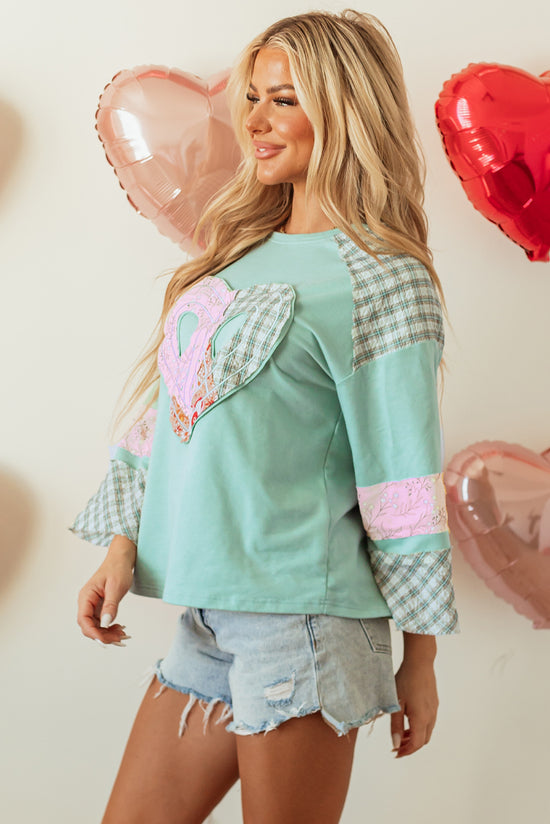 Large high with long sleeves clearly aqua plaid floral peace heart graphic