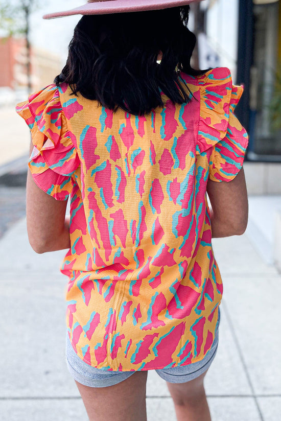 Orange blouse with abstract print *