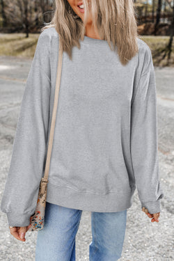 Light gray plain sweatshirt with dropped shoulders and round neck