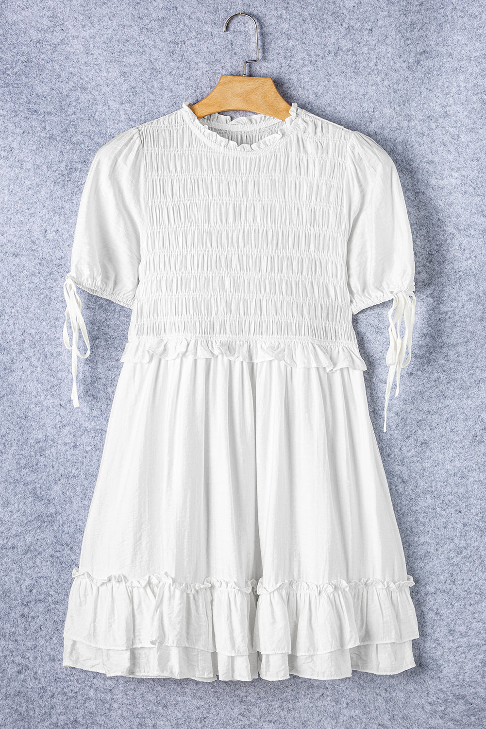 White ruffled and smocked mini dress, short sleeves, tie