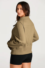 Brown sweatshirt with stand-up collar and kangaroo pocket with quarter-turn zip