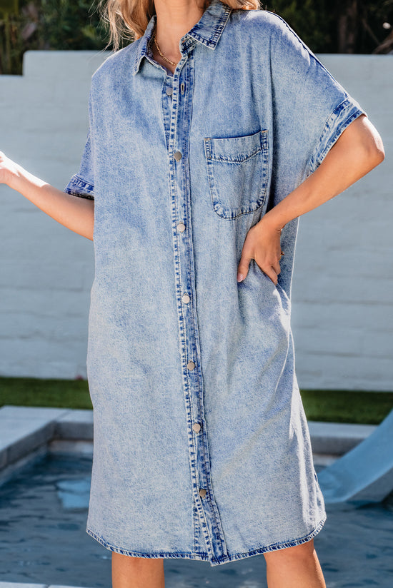 Light blue chambray shirt dress with short sleeves and medium washing