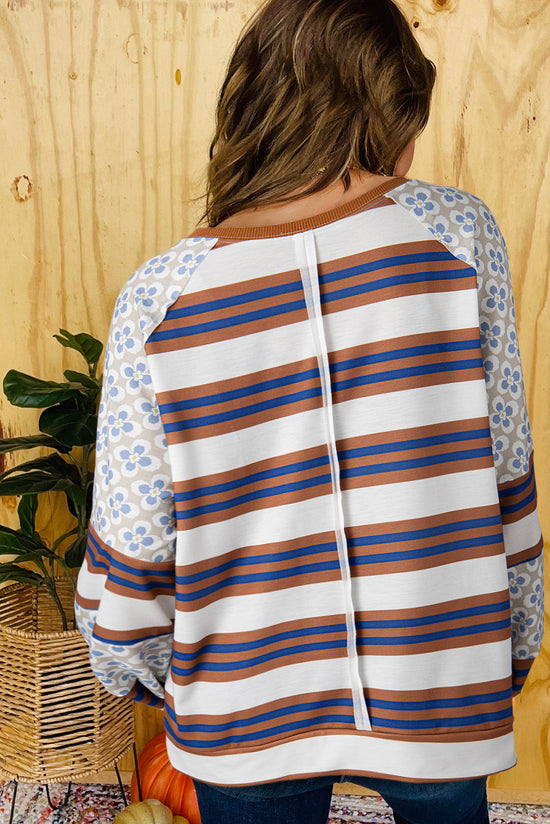 White blouse with lanterns sleeves and striped floral print