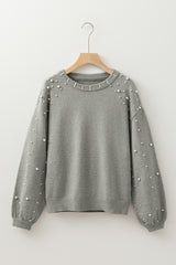 Pull gris clair à col rond et épaules tombantes perlées
