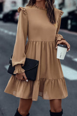 Tiered dress with ruffled shoulders and ruffled collar in light French beige