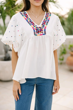 White blouse embroidered with puffy sleeves and v -collar