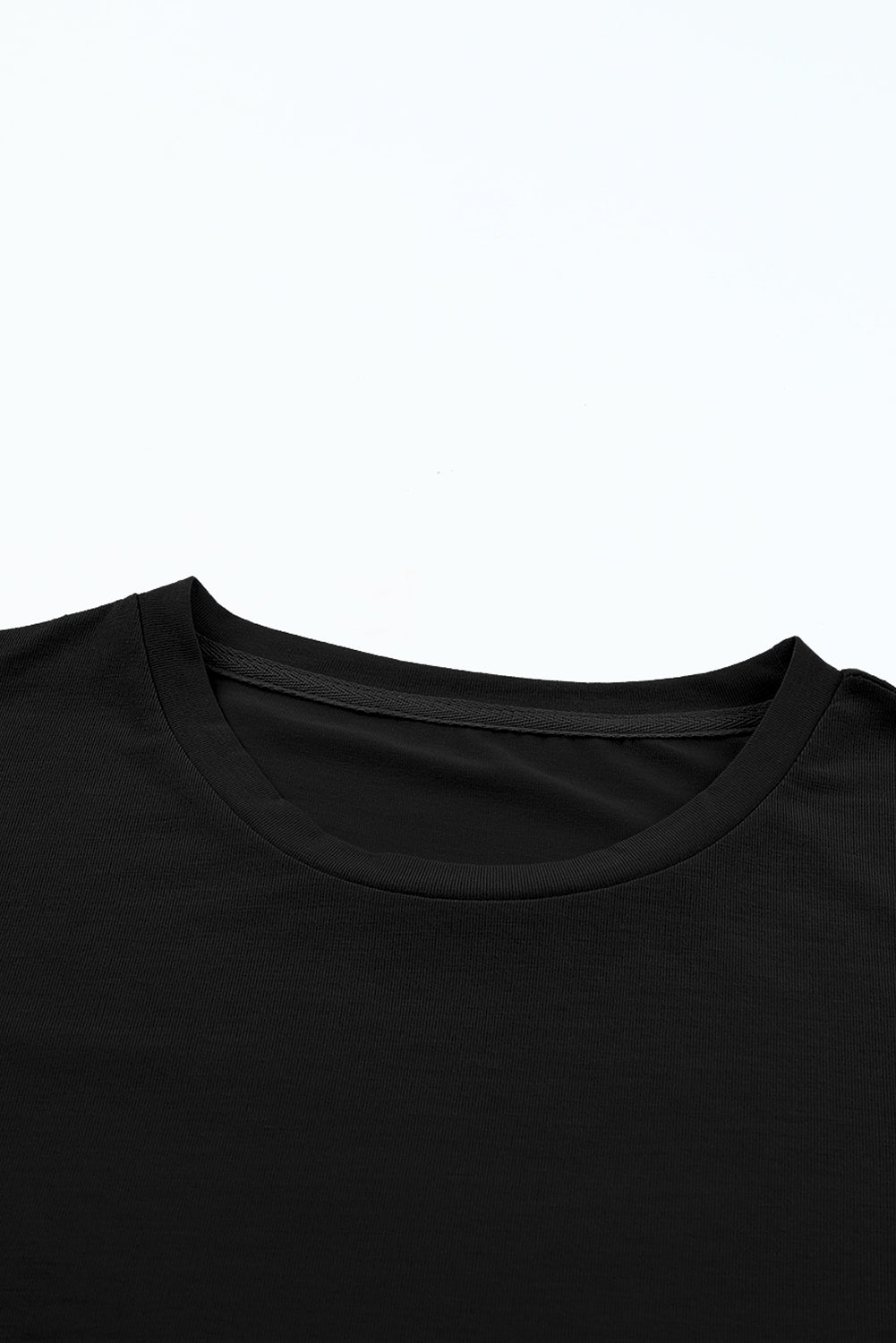 Camiseta negra relajada con placas redondas