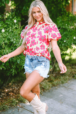 Blusa beige con flores y mangas hinchadas *