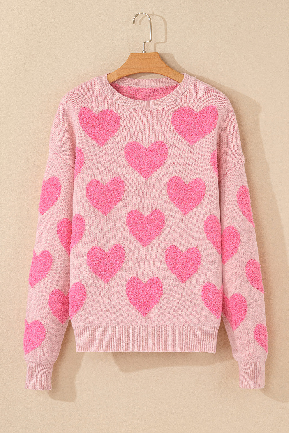 Pull en tricot de coeur de la Saint-Valentin rose clair