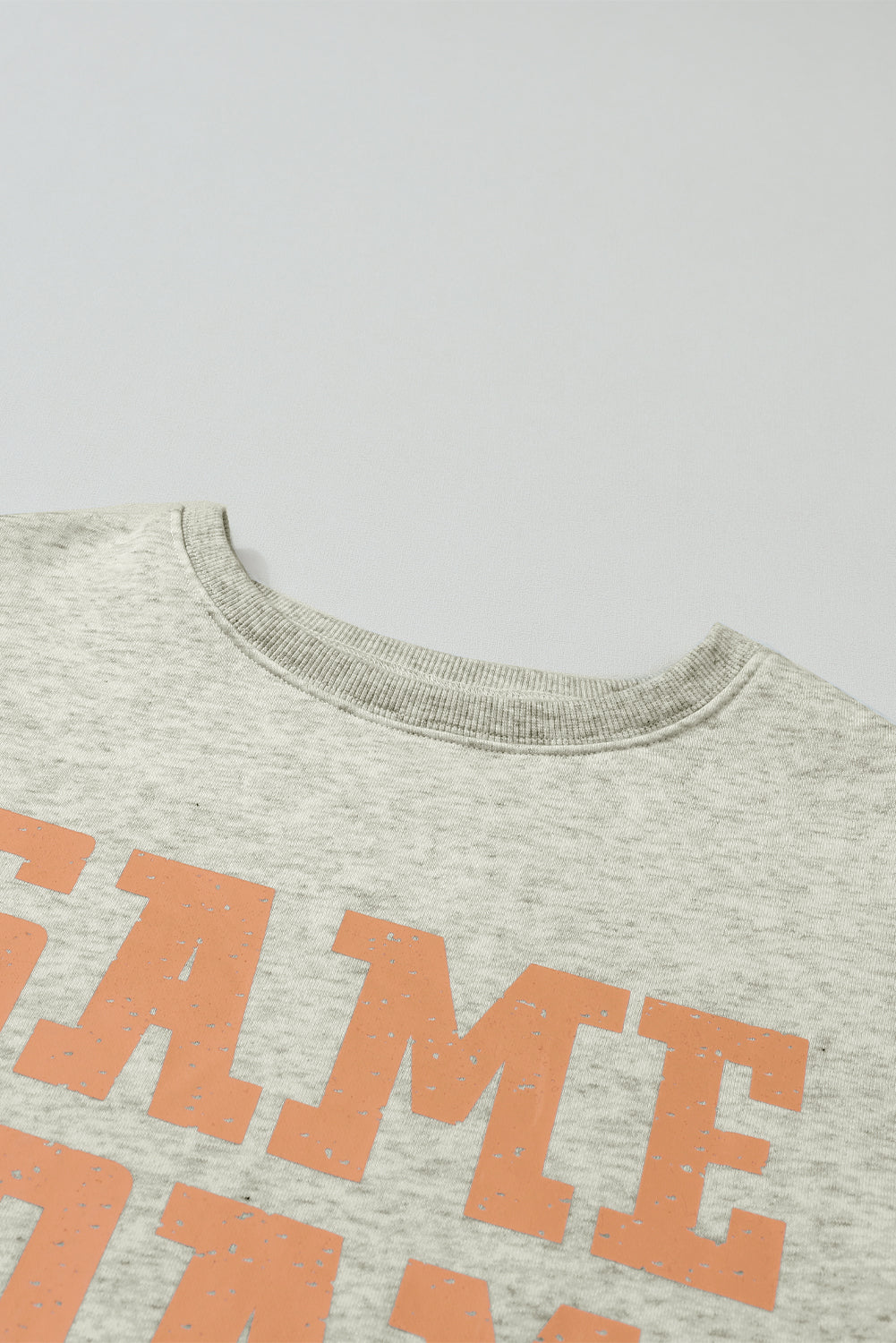 Sweat graphique du jour du jeu orange de pamplemousse