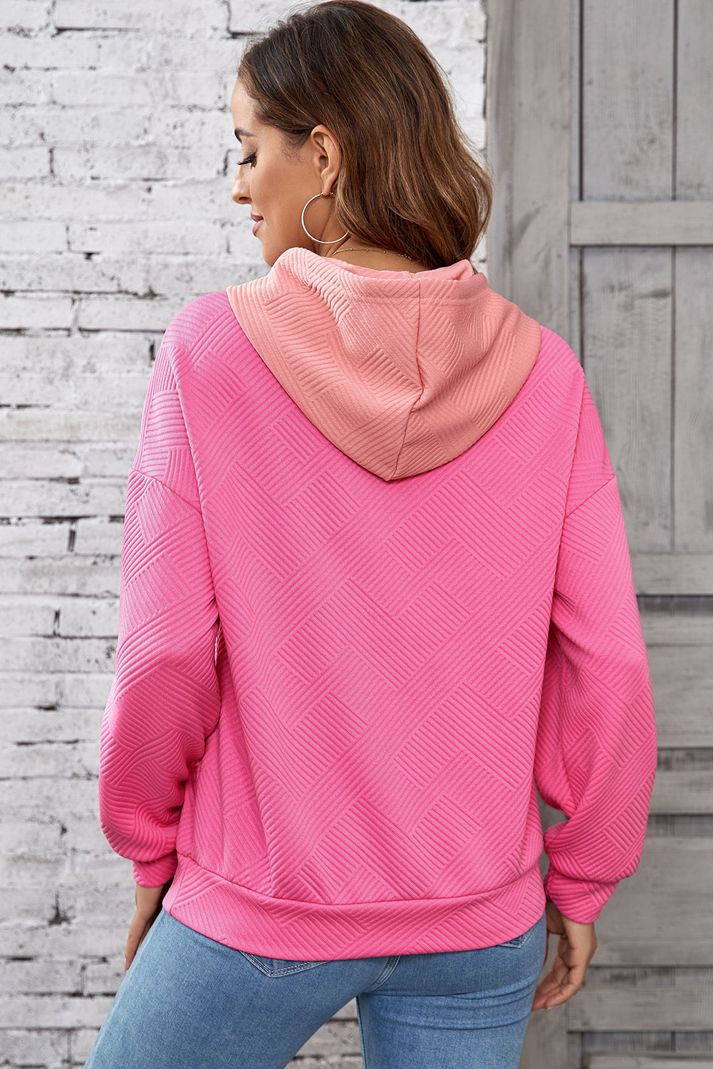 Pink textured hoodie with kangaroo pocket and dropped shoulders