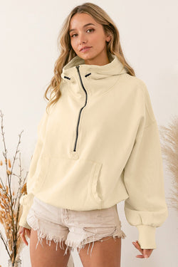 Beige zip-up hoodie with kangaroo pocket and ribbed trim