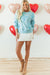 Over-dimensional sequined sweatshirt and butterfly knot with drooping shoulder