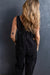 Black denim overalls with adjustable straps and multiple pockets