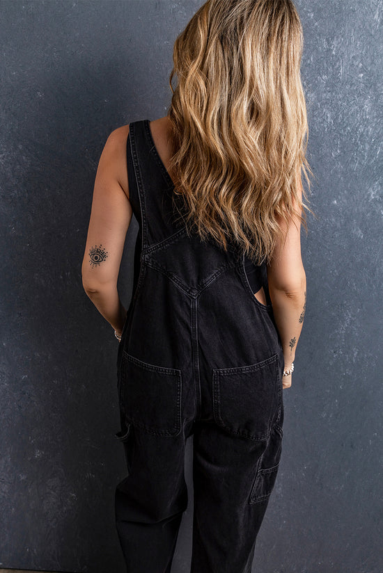 Black denim overalls with adjustable straps and multiple pockets