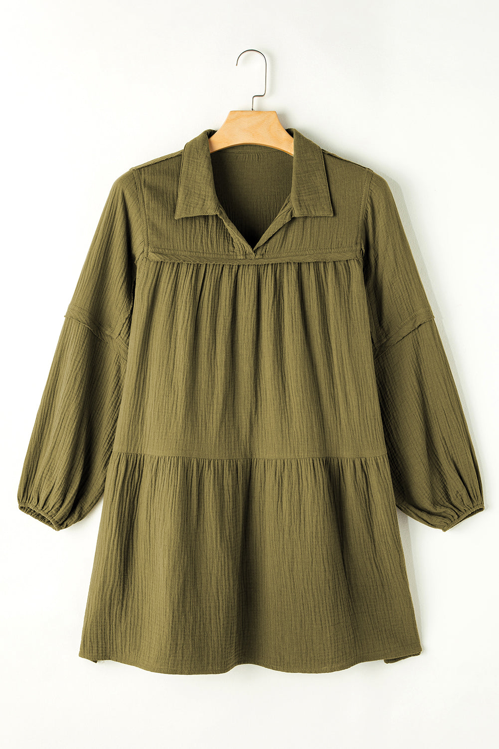 Green flared dress with frayed edging, split collar, puffed sleeves