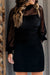 Black dress with bubble sleeves and ruffled collar striped in polka dot stitch