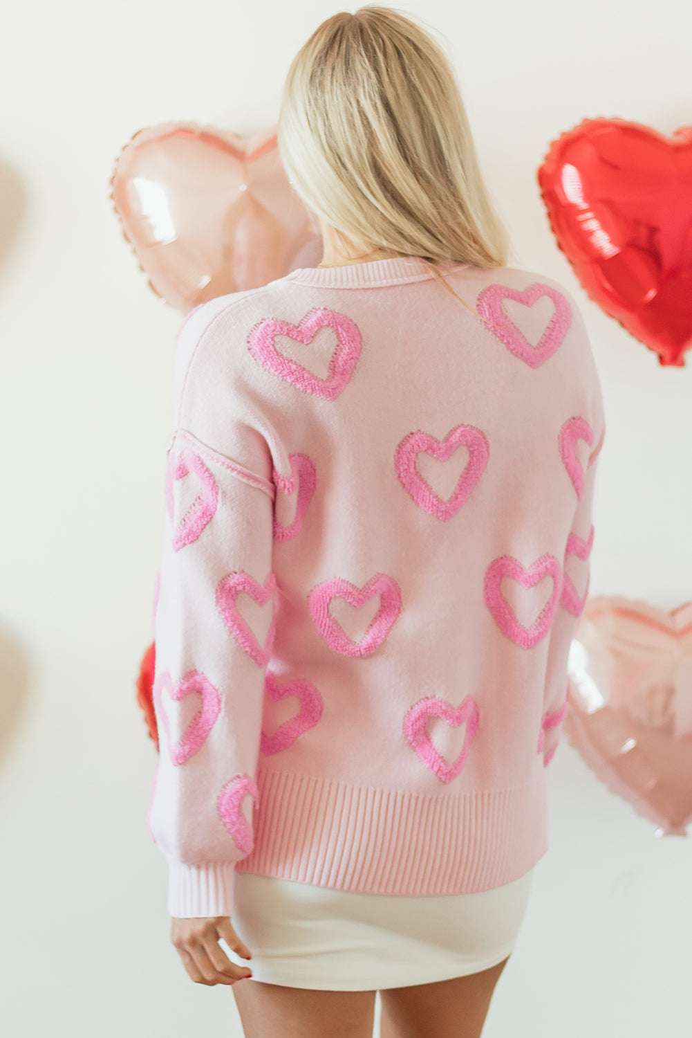 Pull ample rose à manches bulles en forme de cœur