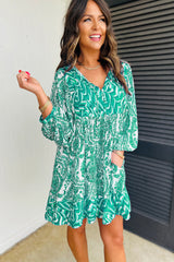 Mini-robe évasée à manches bouffantes et col en V noué à imprimé bohème vert