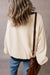 White oversized sweatshirt with dropped shoulders and color block patch